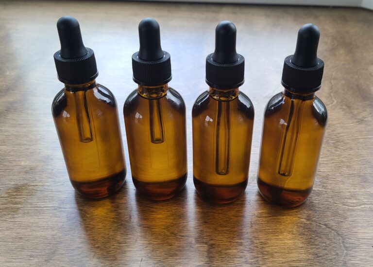 amber bottles containing beard oil
