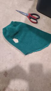 Completed cuts making a no-sew baby goat coat