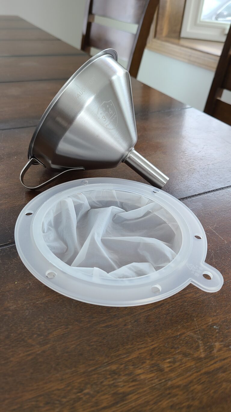 Funnel and strainer for goat's milk