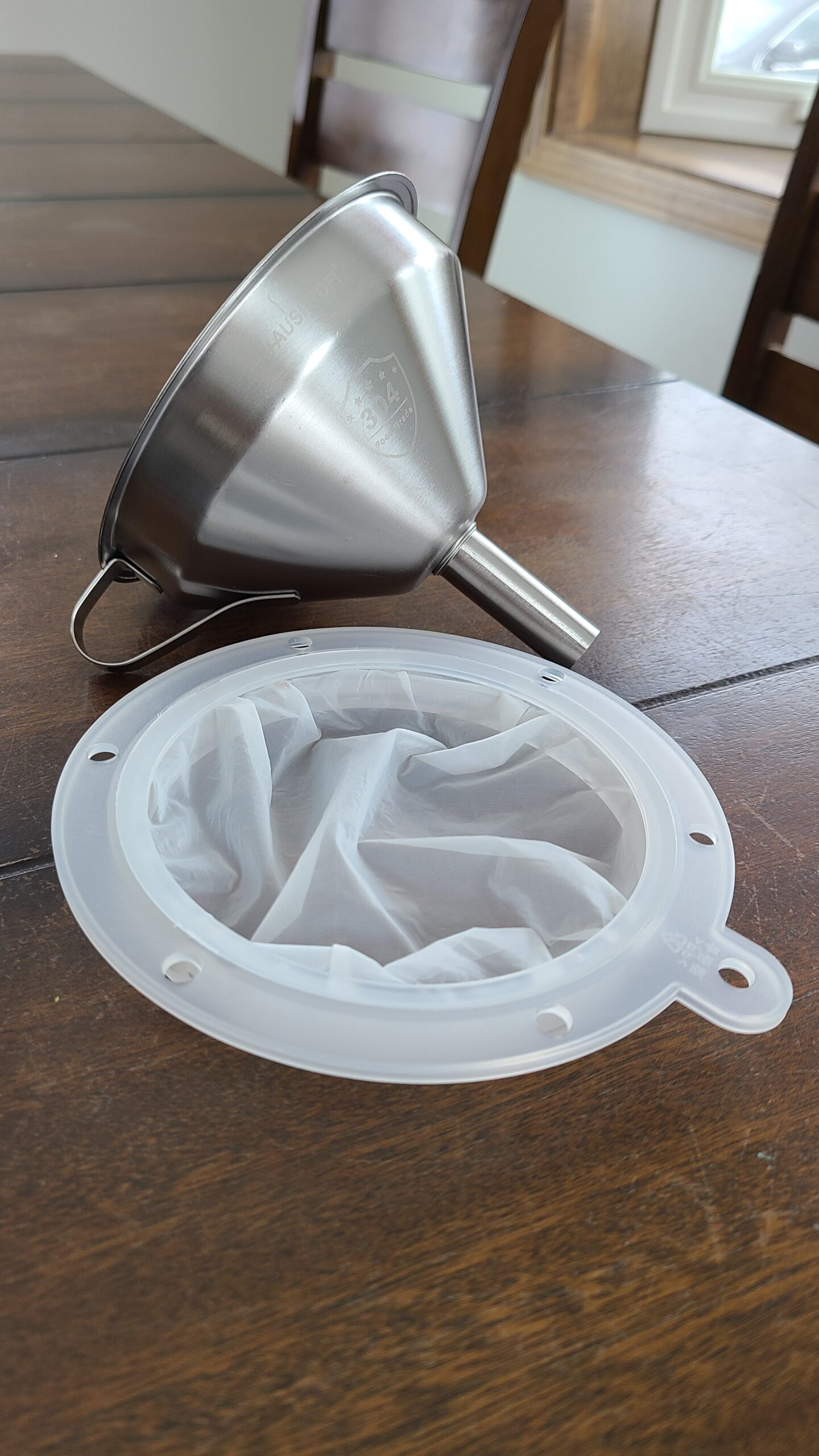 Funnel and strainer for goat's milk
