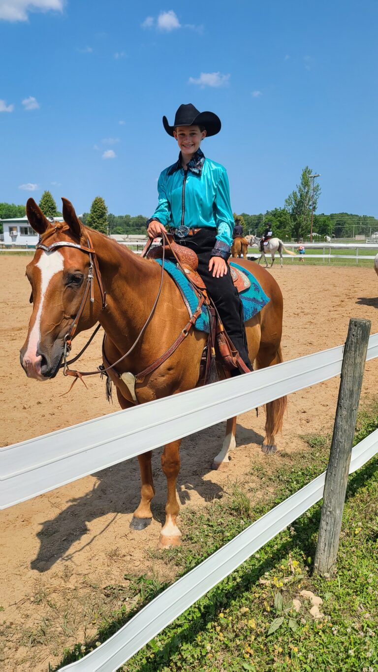 Girl and a horse in a western show