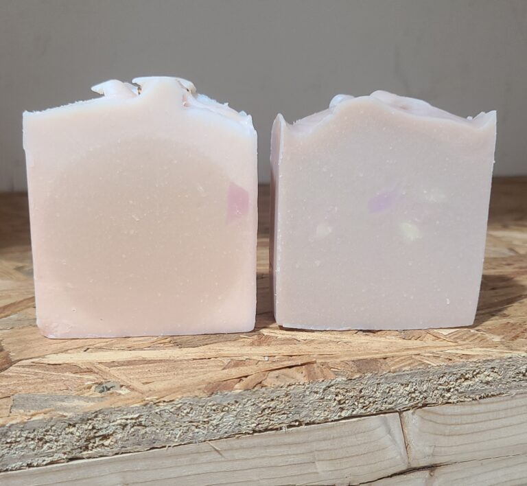 Two bars of goat milk soap.