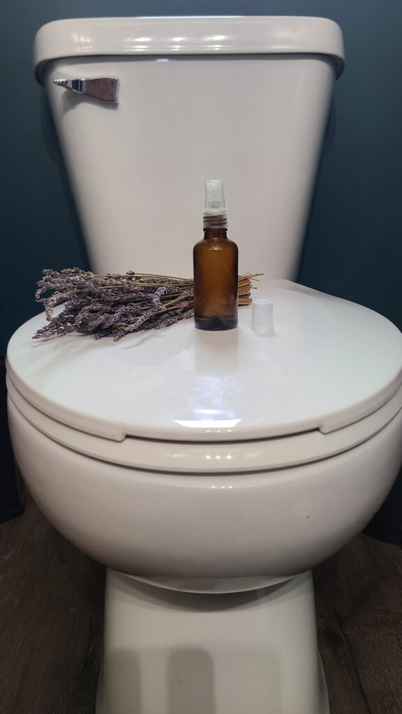 Toilet with lavender and spray on the lid