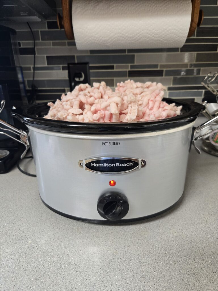 Render lard in a slow cooker from ground pork fat
