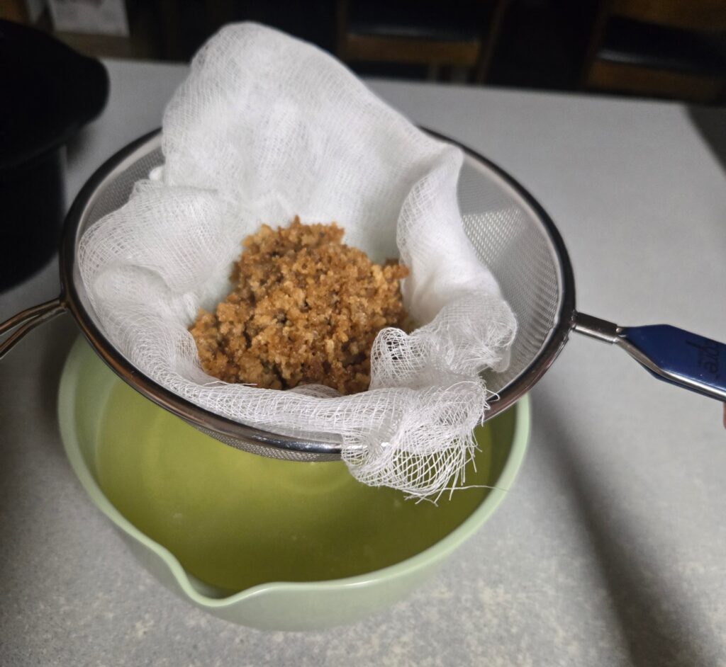 Cracklings and lard below in a bowl
