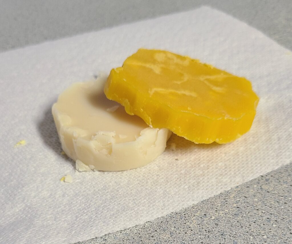Rendered beeswax on top of rendered tallow