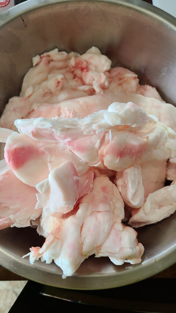 Wet render tallow from suet from a white tailed deer in a bowl