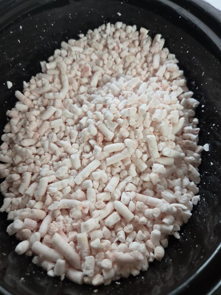 Dry render tallow in a slow cooker after running through a meat grinder.