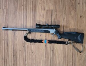 Gun with a hand woven mohair sling.