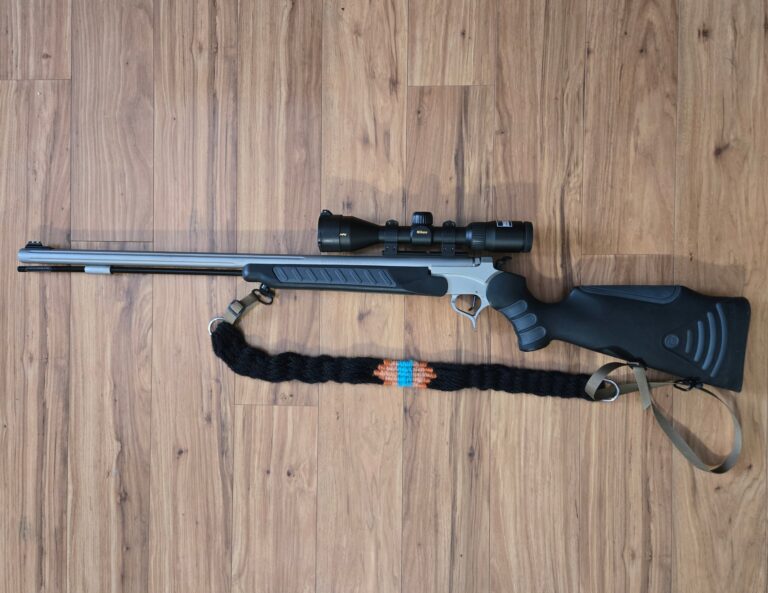 Gun with a hand woven mohair sling.