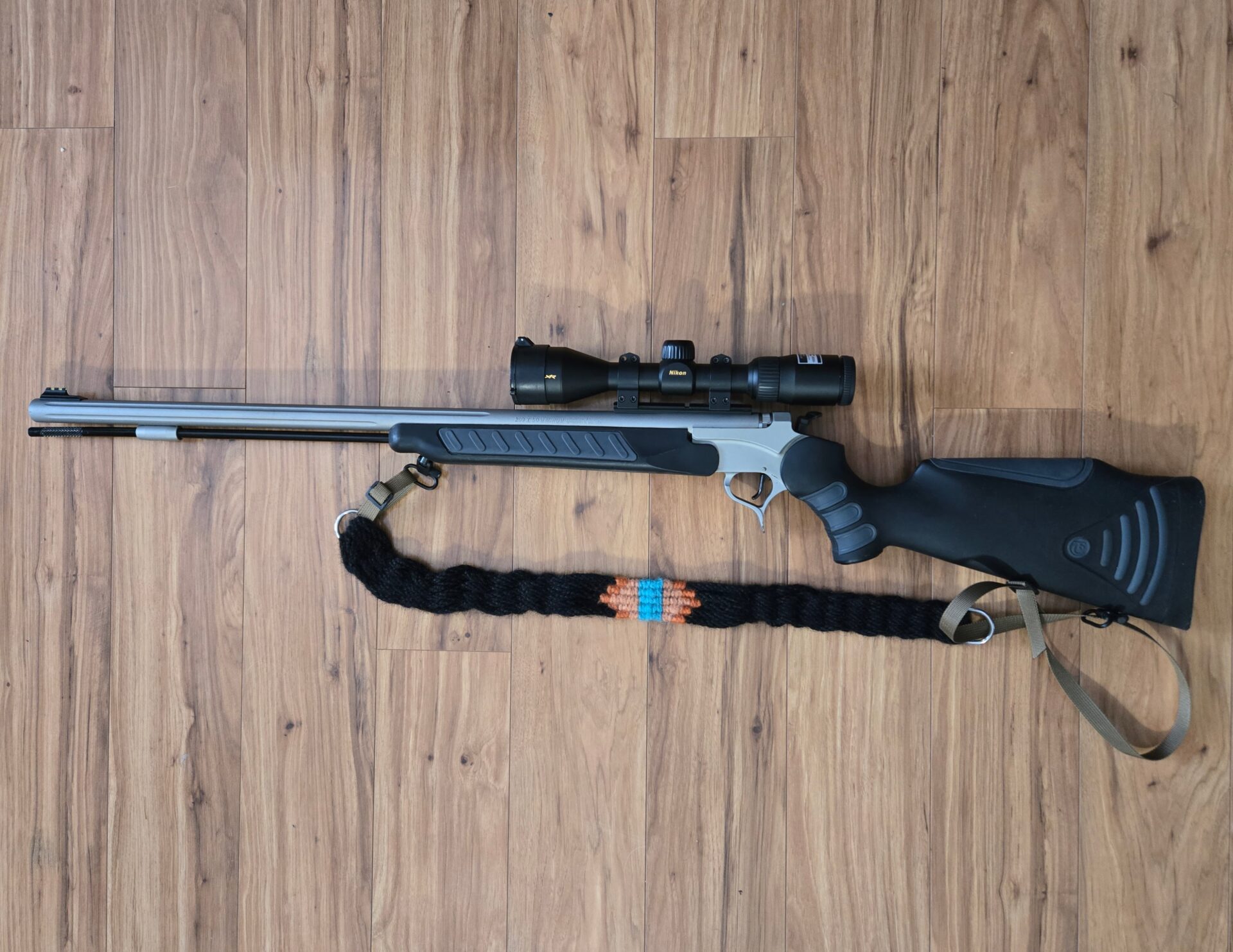 Gun with a hand woven mohair sling.