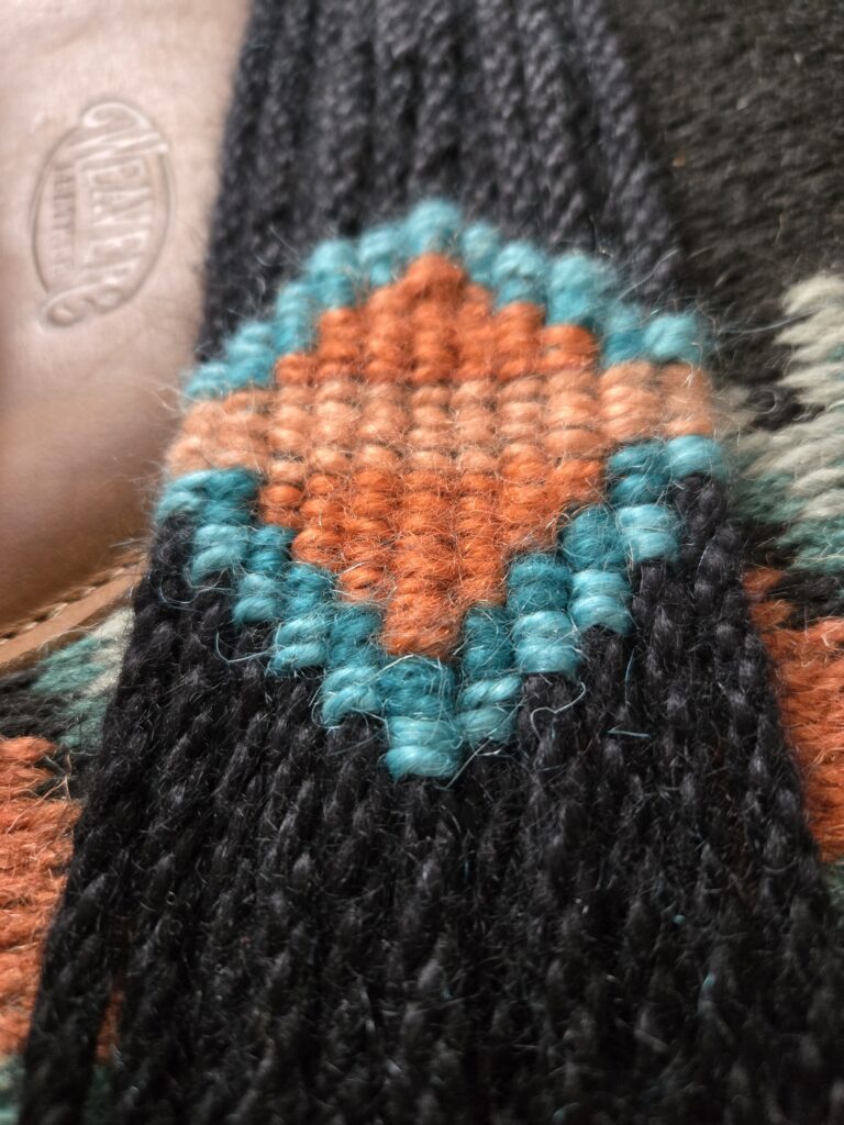 Close-up of a hand-woven mohair breast collar.