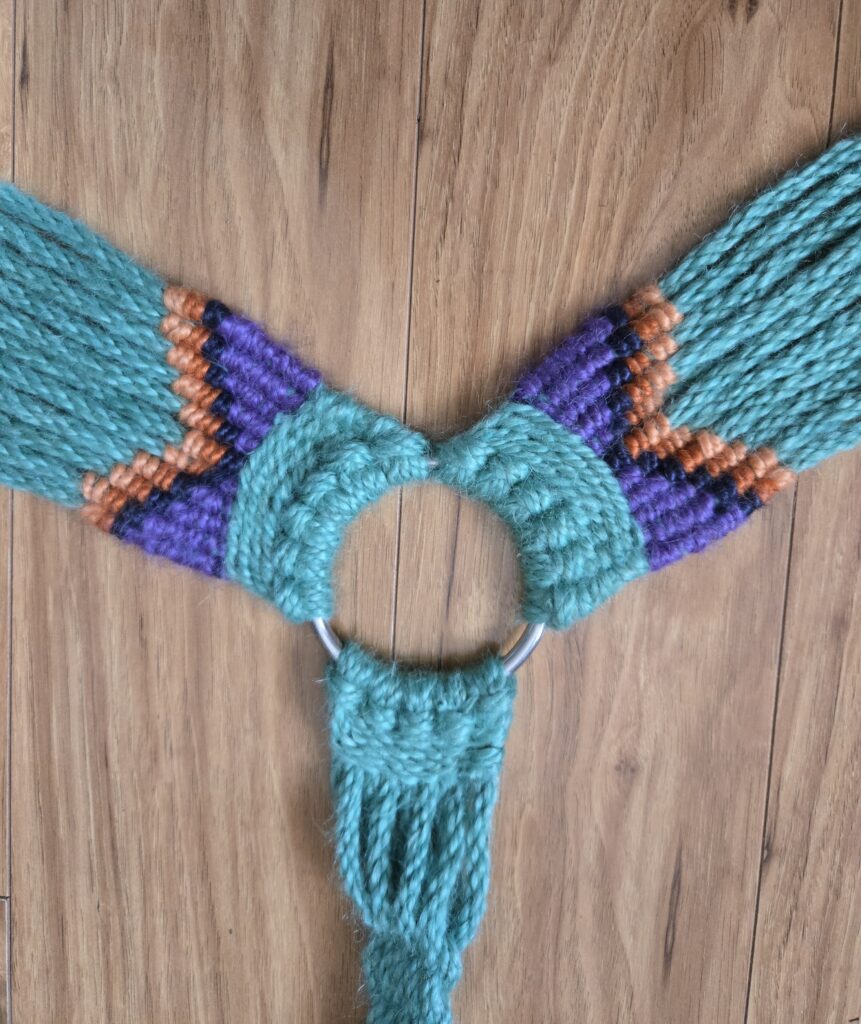 Close-up of a hand-woven mohair breast collar.