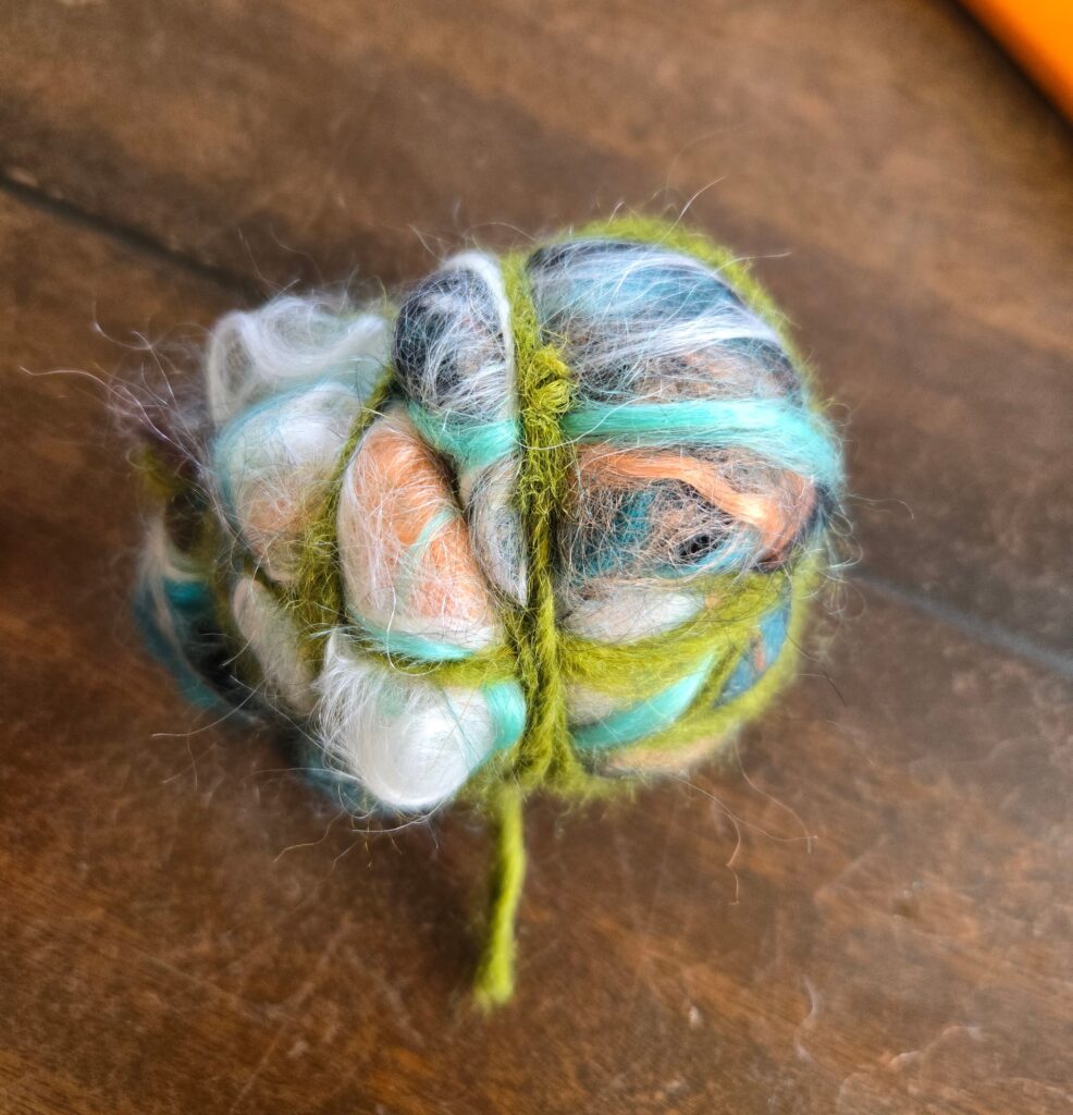 Ball of yarn scraps tied together