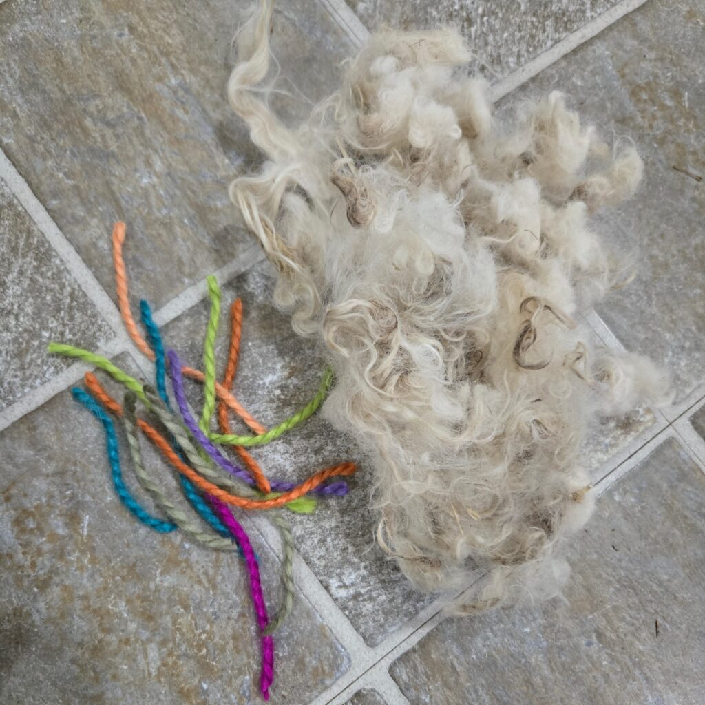 Scrap yarn and raw mohair fleece