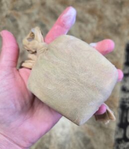 Fiber wrapped soap in a nylon stocking.