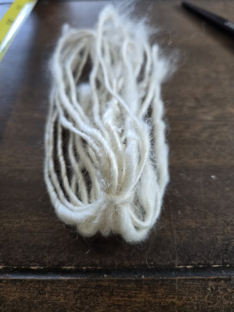 Tied and folded white yarn