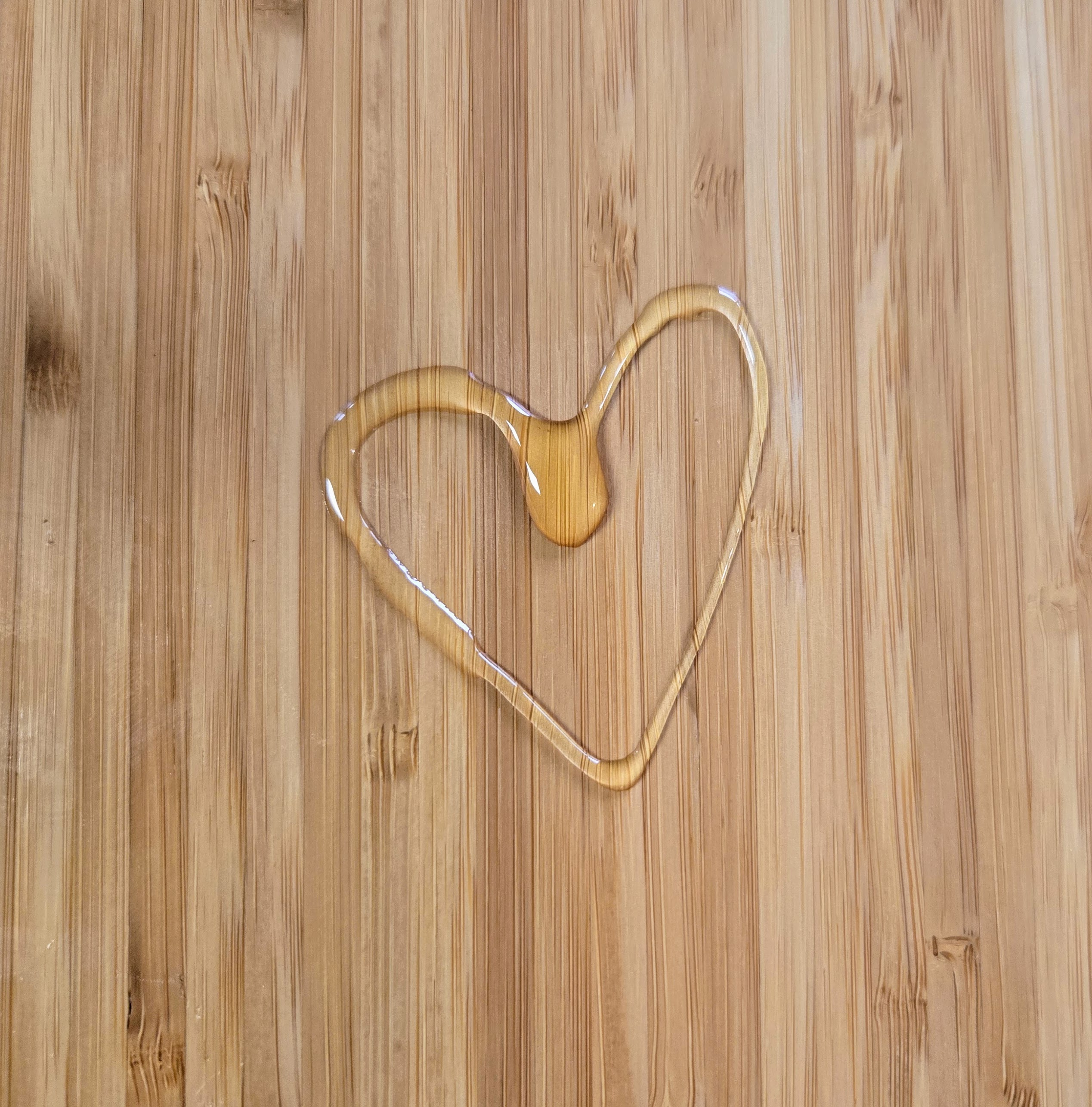 A heart made out of dripped honey.