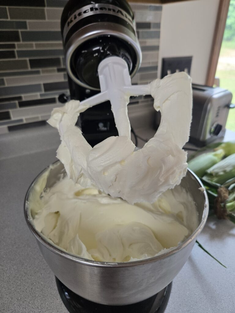 KitchenAid mixer with whipped tallow in the bowl.