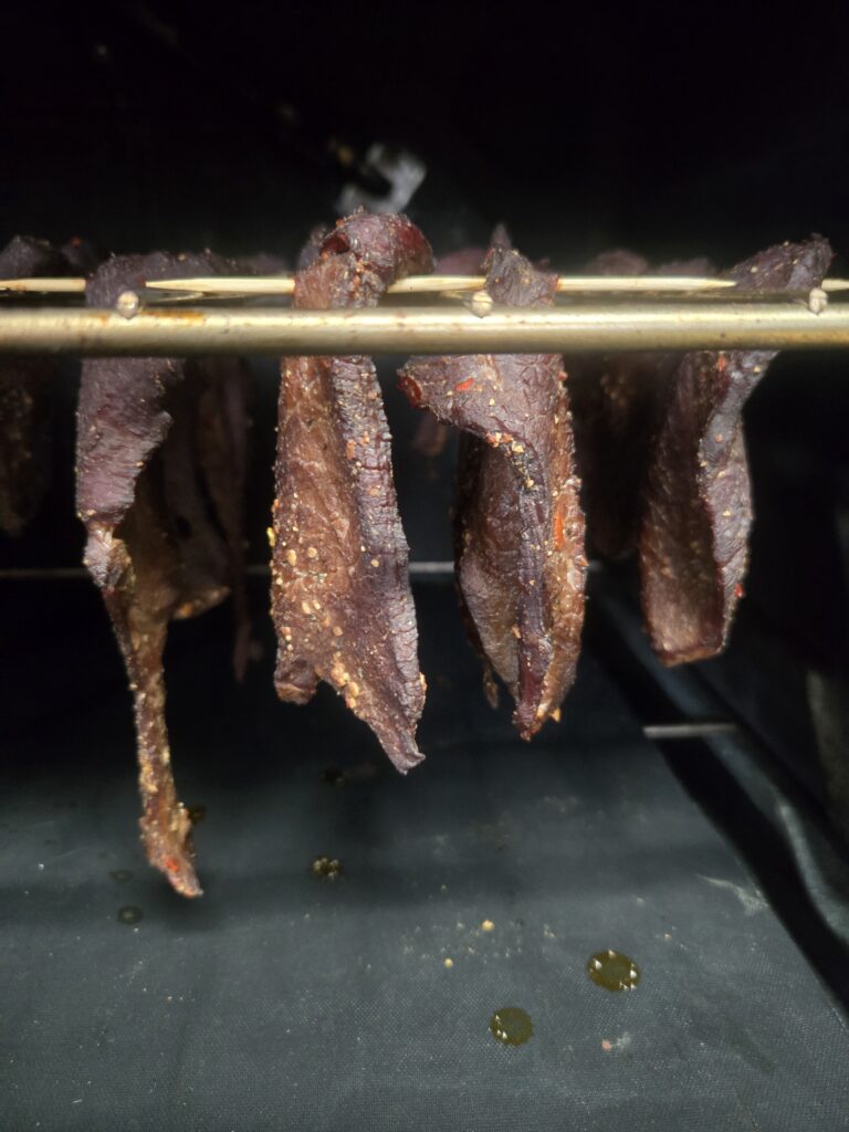 Meat hanging in the oven to dry.