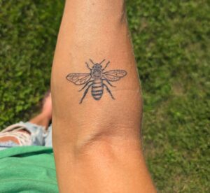 Bee tattoo on a forearm