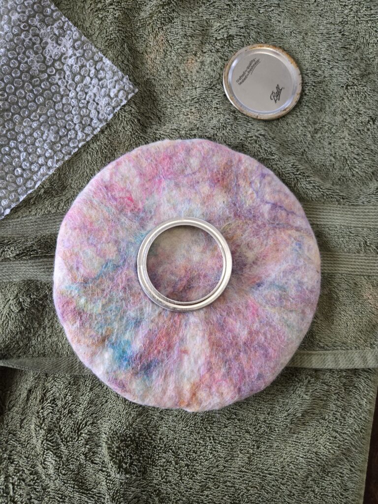 Planning the hole for the wet felted bowl