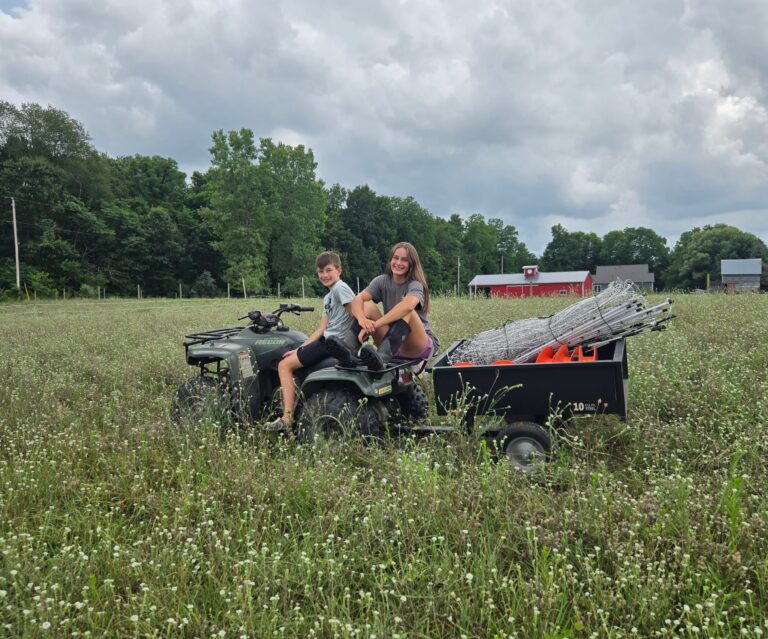 Rotational grazing supplies for goats in a trailer pulled by an ATV