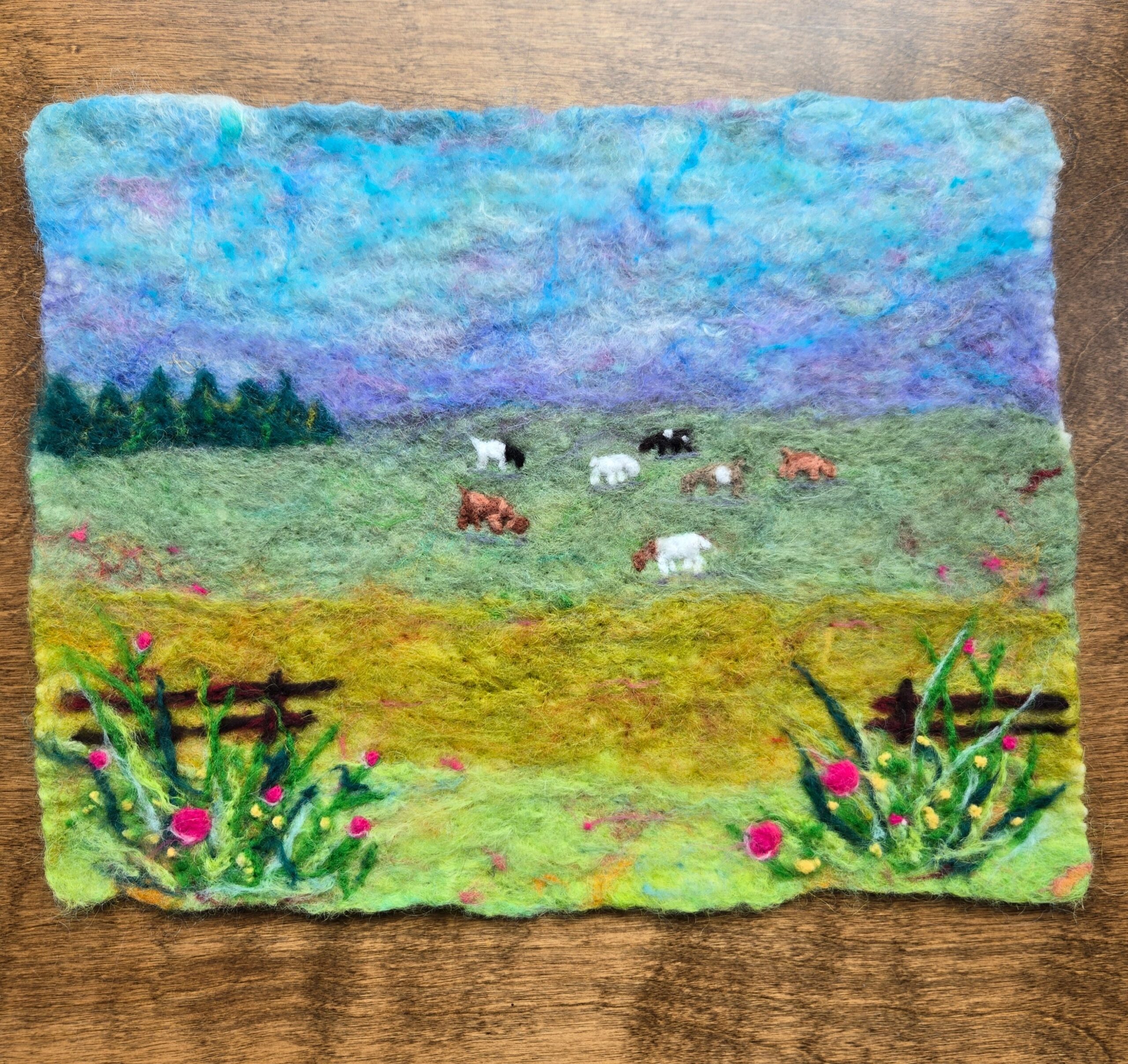Felted landscape scene.