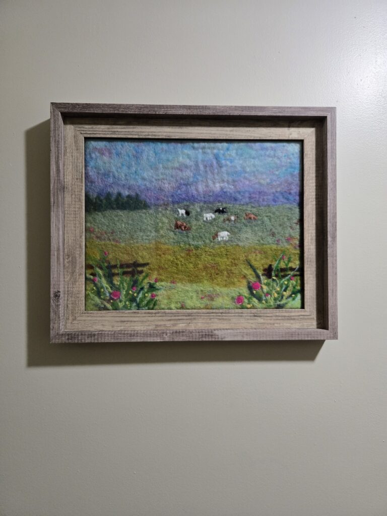 Framed wet-felted landscape picture.
