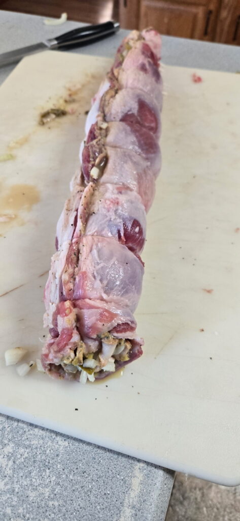 Goat belly rouladen rolled and tied.