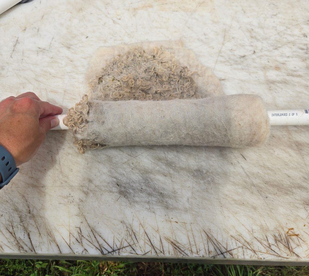 Rolling the collar around a PVC pipe.