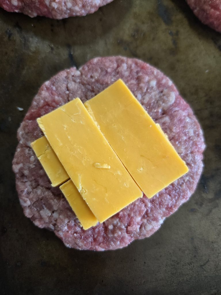 Cheese on a goat burger